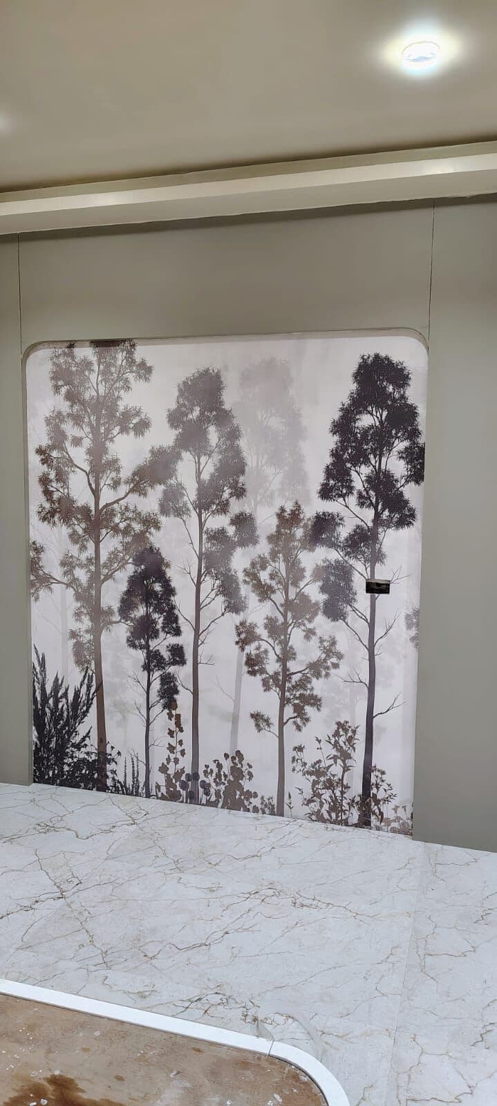 Tree-print panel beside a counter
