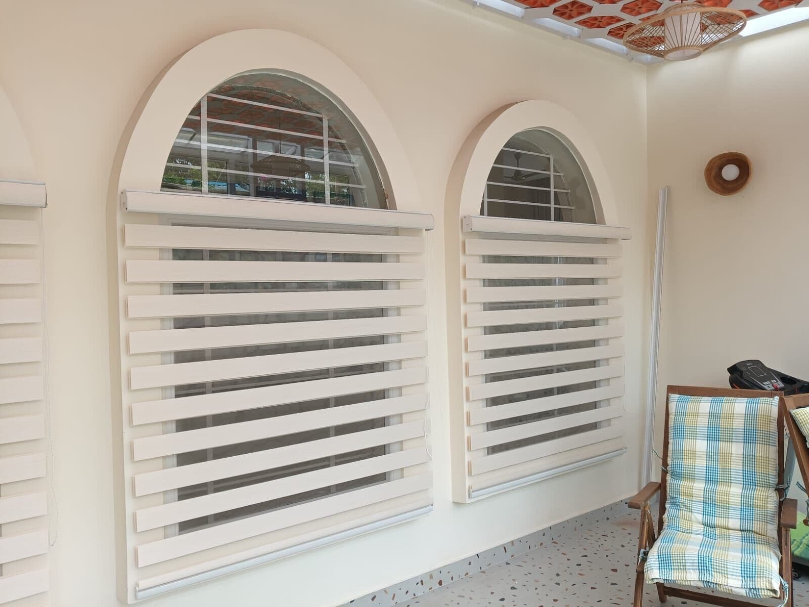 Zebra blinds across arched windows
