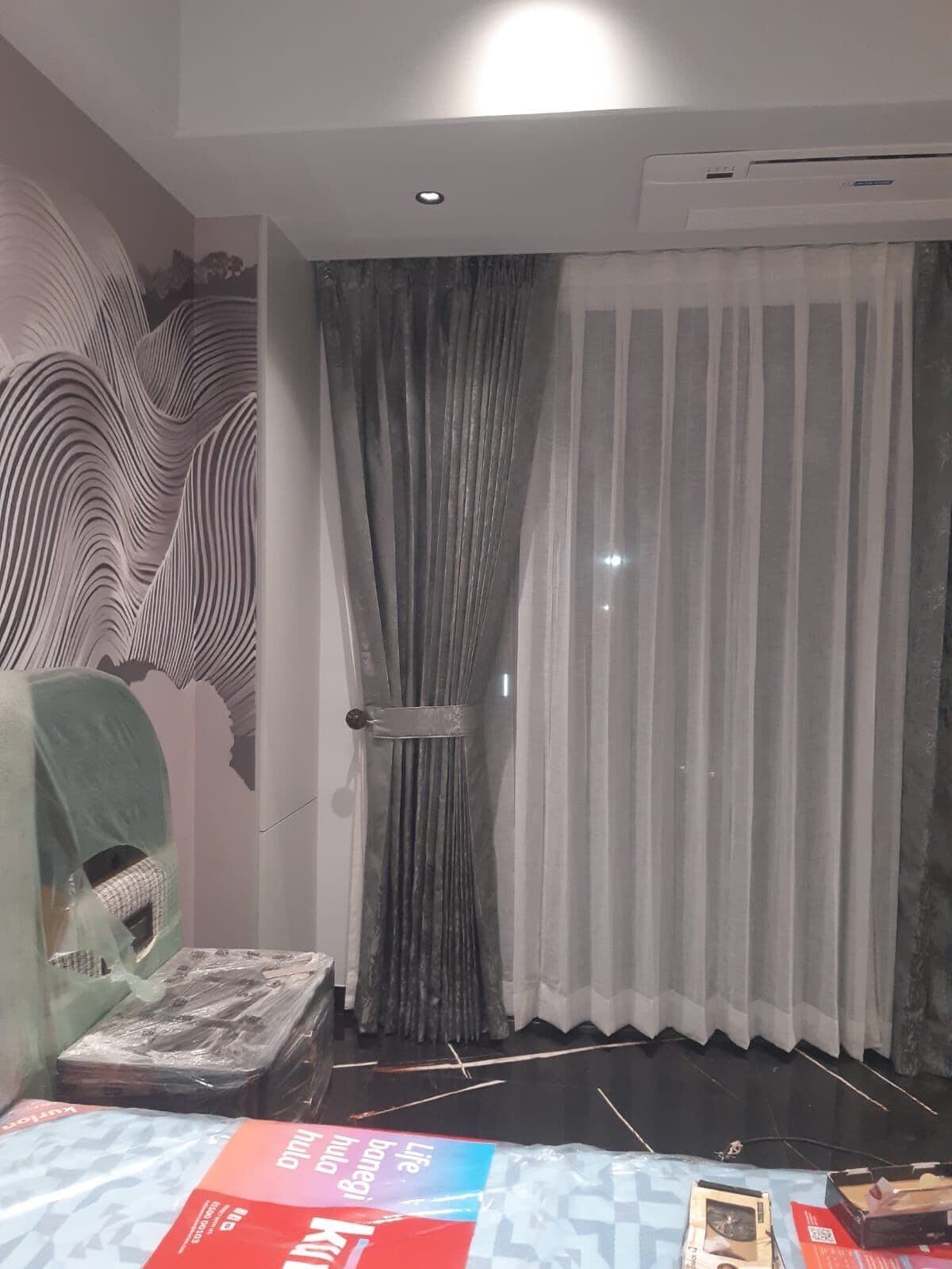 Bedroom drapes with a textured feature wall