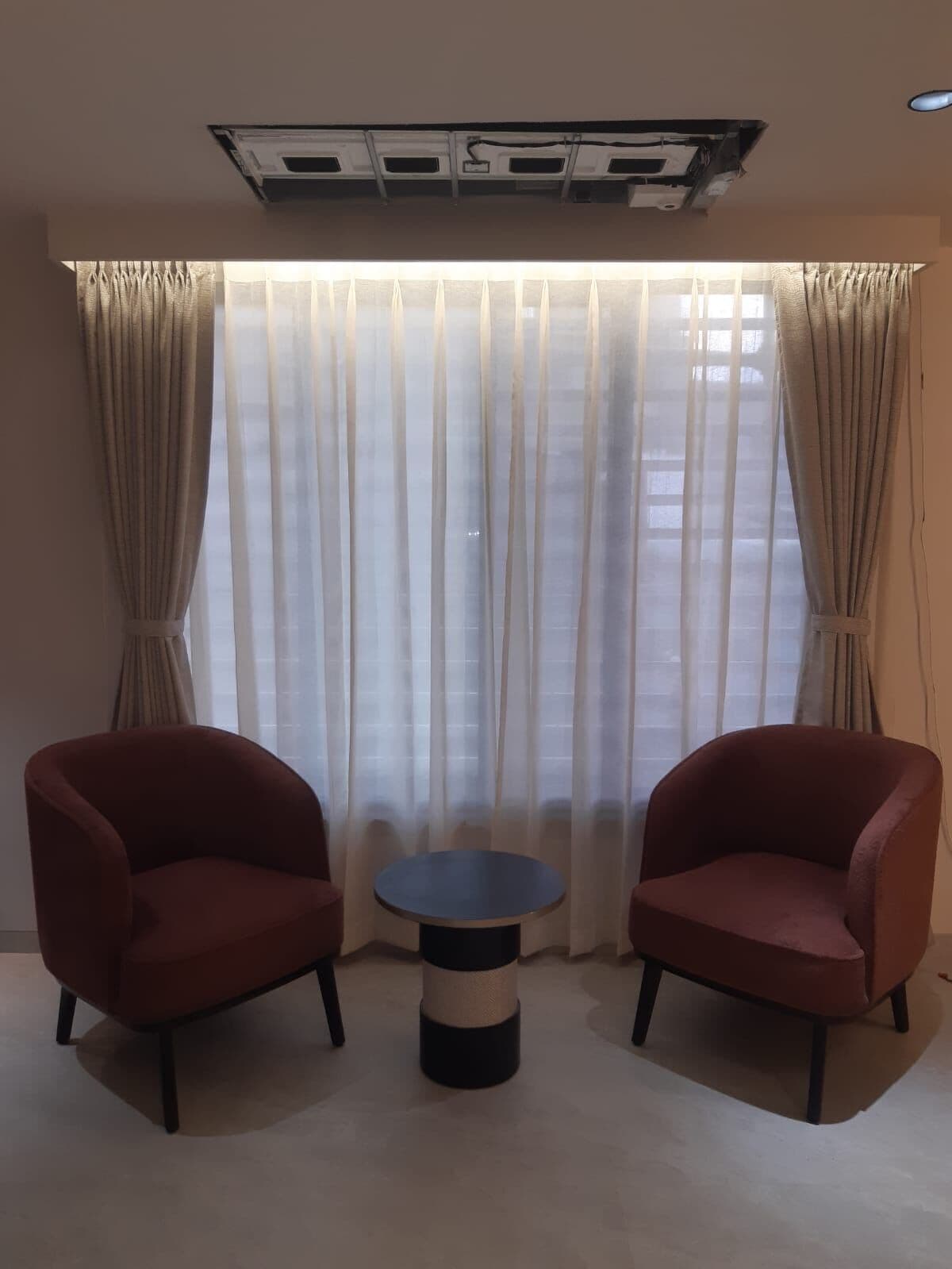 Sheers behind a two-chair nook